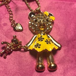 bear with doll necklace
